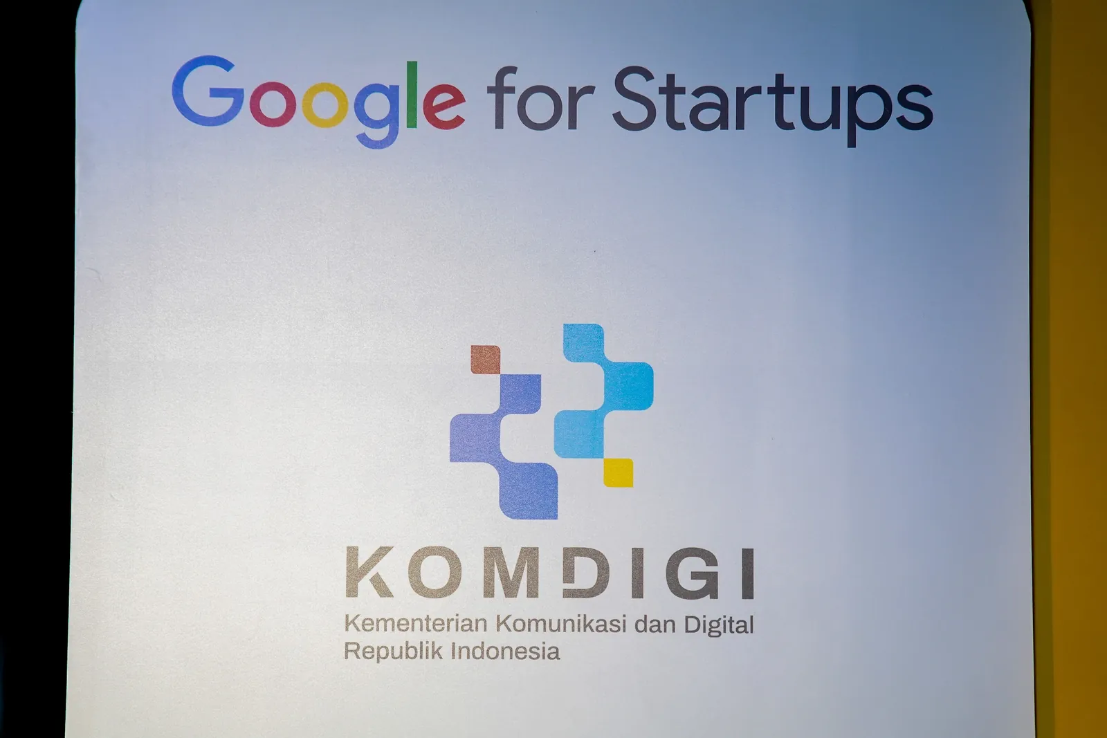 Google for Startups and Komdigi (Kementerian Komunikasi dan Digital Republik Indonesia) partnership backdrop at AI Showcase Day