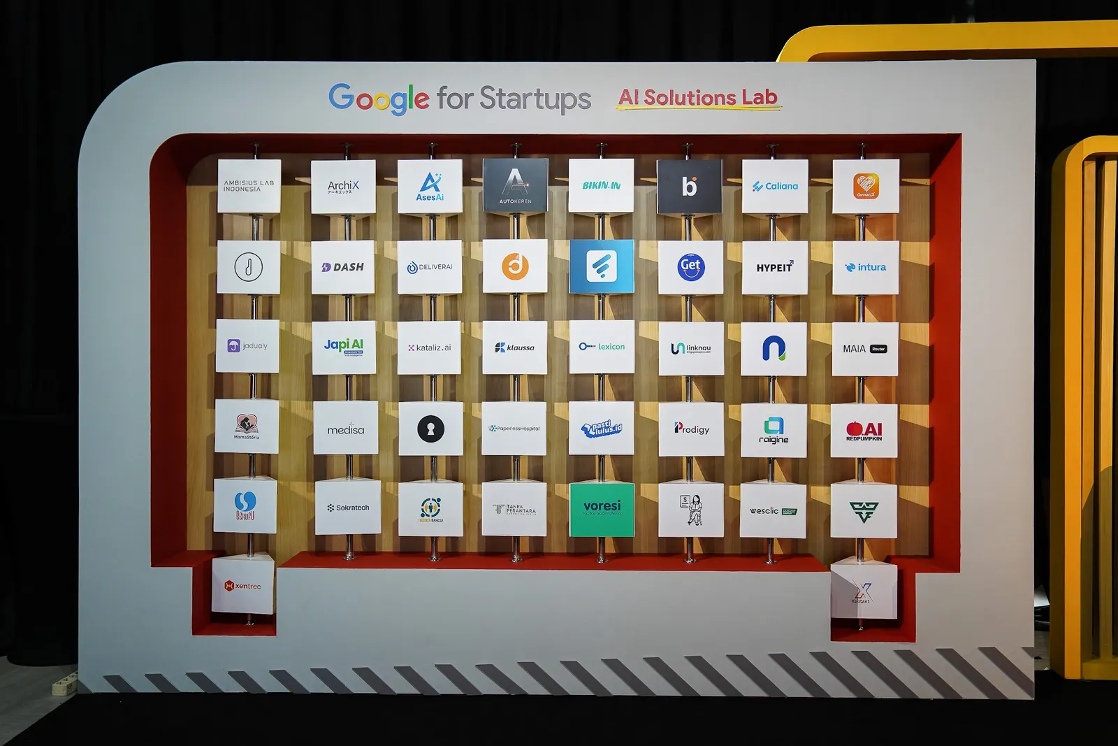 Google for Startups AI Solutions Lab cohort wall featuring Intura and dozens of Indonesian AI startups